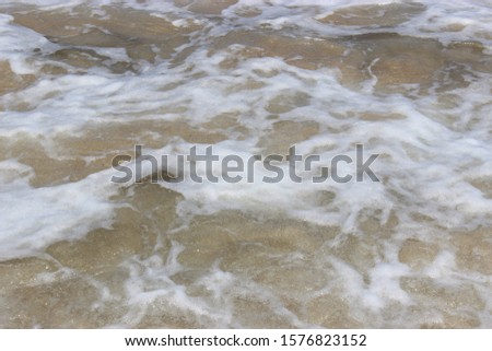 a beautiful close up of sea foam and waves on st.ives, carbas bay, Cornwall beach