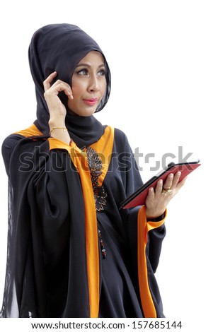 Muslim asian female student with tablet computer