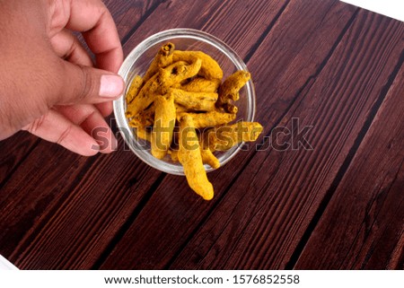 Turmeric on bowl Isolated wooden 