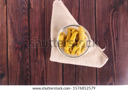 Turmeric on bowl Isolated wooden 