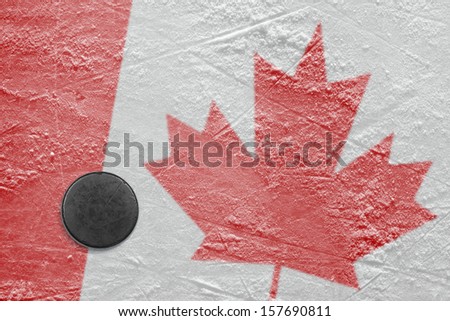 Puck and a Canadian flag image on the hockey rink