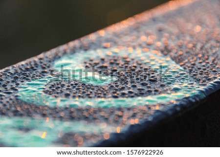On the picture the heart is represented on the metal surface, that covered with the morning dew.