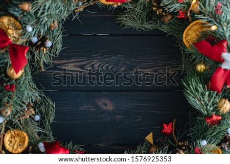 Handmade Christmas wreath on wooden background flat lay
