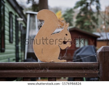 Wooden Squirrel Cutout with Frozen Cobwebs