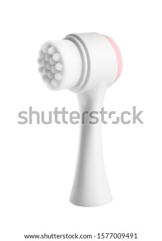 Modern face cleansing brush isolated on white. Cosmetics tool