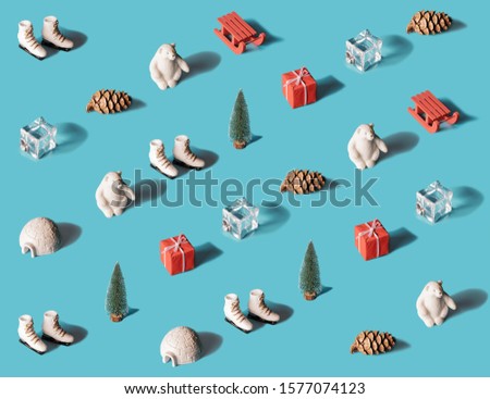 Trendy isometric Christmas pattern made with symbolic winter and New Year objects on blue background. Minimal holidays concept.