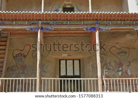 3 story high wooden porch. Caves 16-17-365-366. Mogao Caves S.section comprising 492 caves and cell temples-some open to tourists housing Buddhist art from centuries 4th to 14th. Dunhuang-Gansu-China.