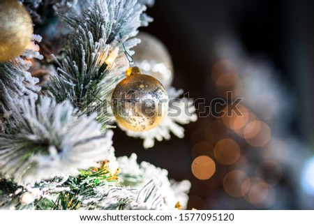 Golden Christmas ornament in tree