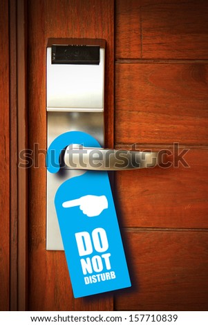 Do not disturb sign hang on door knob Royalty-Free Stock Photo #157710839