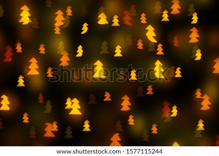 christmas tree shaped yellow bokeh of lights