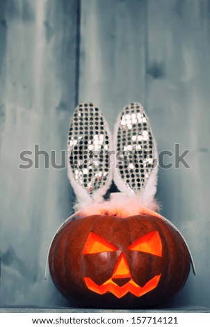 Halloween photo of pumpkin with bunny ears