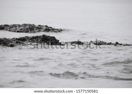 Beautiful minimal background of rocks and sea