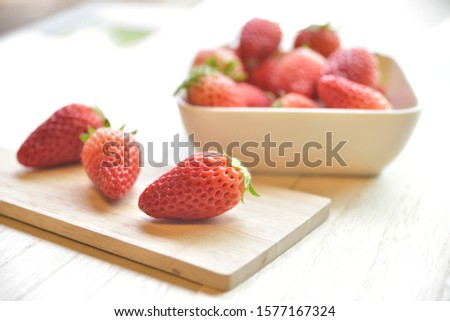 
It is a picture of a cute strawberry