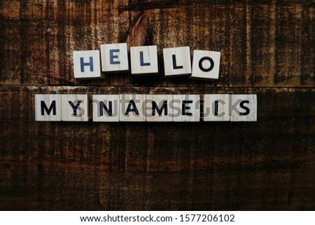 Hello My name is alphabet letter on wooden background