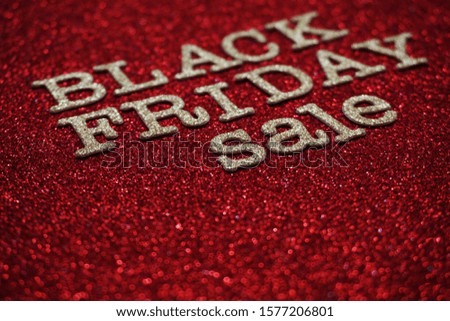 Black Friday sale shopping concept alphabet on red background