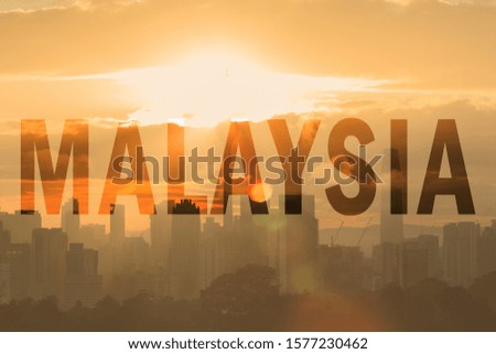 scenery of malaysia skyscraper during sunrise with wording
