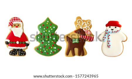 Cute Christmas cookies in shape of Santa Claus , Christmas tree, red nose reindeer, snow man on isolated background.