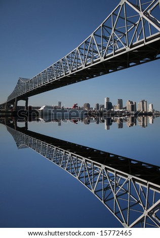 crescent city connection bridge and New Orleans skyline reflected