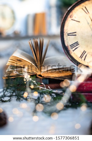red vintage watch, christmas interior, old book