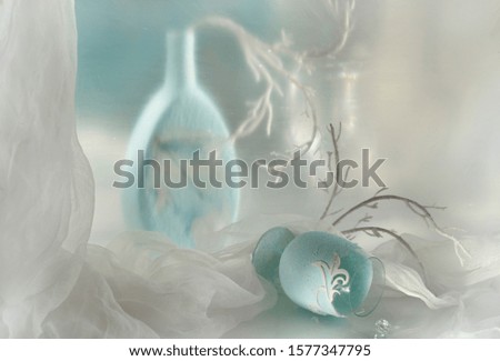 still life  -  post card card with Christmas composition with branches, a blue vase and a glass on a white background