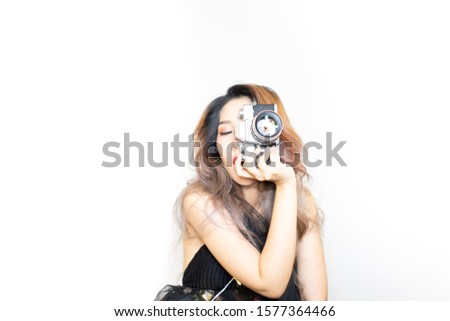Young asian women photographer with camera on isolated background