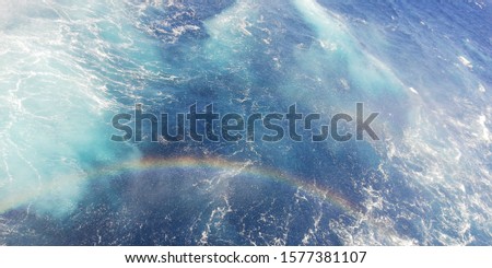 rainbow over the sea water