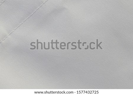 Snow white cotton background. Surface of fabric texture in white winter color.