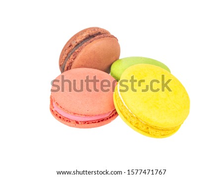 Four multicolored macaroons on a white background