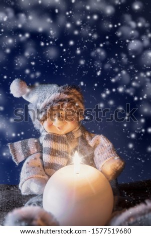 Christmas greeting card with snowman and candle
