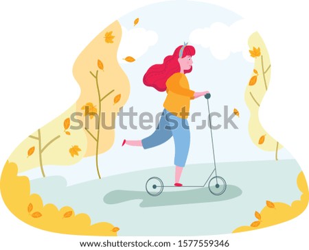 Girl riding kick-scooter in autumnal park