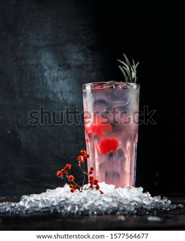 pink cocktail with cherry, blue cocktail with pineapple, transparent with soda in rox
