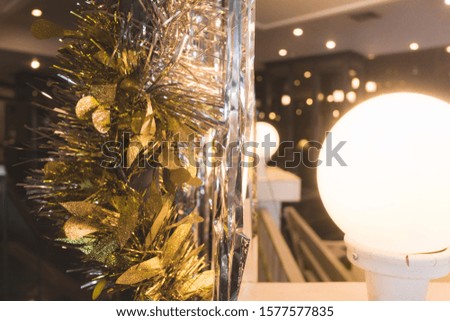 Christmas tree with gold lights against an old wood background.
