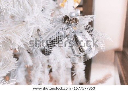 Christmas Tree with Bell and Gold Background.