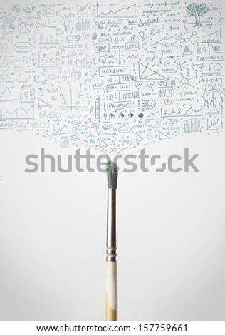 Paintbrush close-up with sketchy diagrams