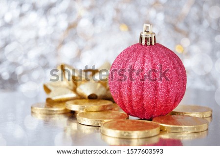 new year ball, gold chocolate coins and new year decorations on shining background with copy space, xmas background, Wealth and health new year concept