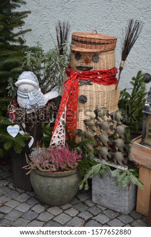 Winter street decoration of snowman made of straw