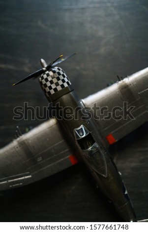 Plastic model WW2 plane on dark background
