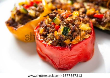 Ground beef and vegetable stuffed peppers  Royalty-Free Stock Photo #1577667313