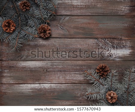 Christmas concept background. Pine on wooden background.