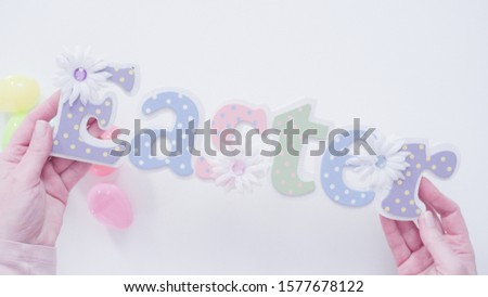 Colorful Easter sign on a white background.