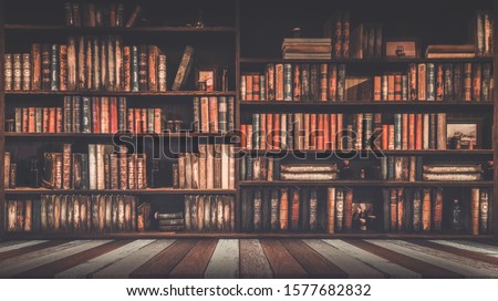 blurred bookshelf Many old books in a book shop or library Royalty-Free Stock Photo #1577682832