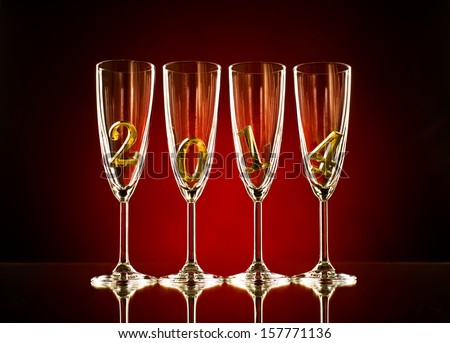 four glass goblet for champagne with  numeral 2014,  beautiful celebrations  New Year concept photo