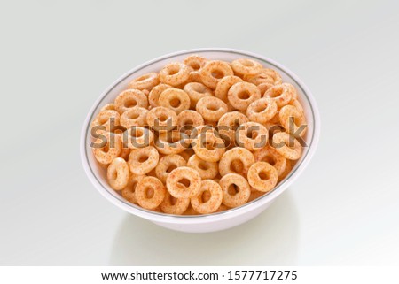 Fried and Spicy Mini Ring Snacks or Fryums (Snacks Pellets) served in a white bowl. selective focus - Image Royalty-Free Stock Photo #1577717275