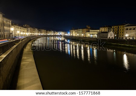 Night picture of the river Arno in Pisa, Italy