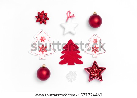 New Year and Christmas composition from red balls, white stars, chrismas tree, deer on white paper background. Top view, flat lay, copy space, square, instagram, from above Royalty-Free Stock Photo #1577724460