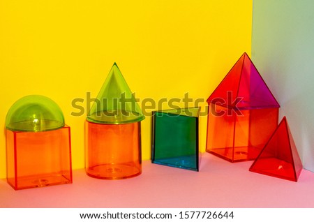 Colored transparent plastic geometric shapes.
