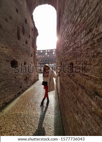 Smiling young girl in a old ruins in Italy