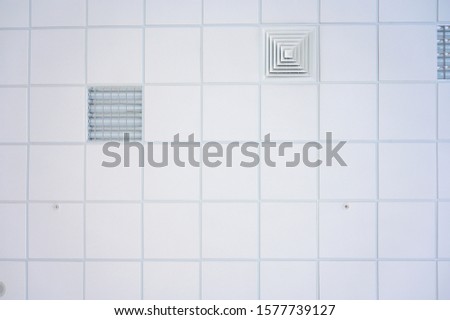 Squared background concept in white. Photo of the ceiling in the building.