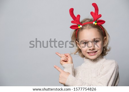 Little girl in winter look. Christmas concept.