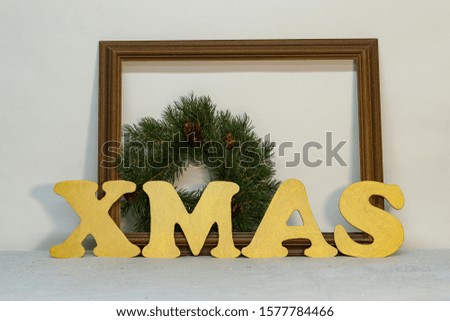 XMAS - Christmas still life with golden letters made of plywood